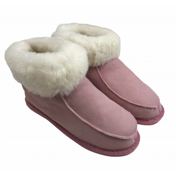 chaussons en peau de mouton rose